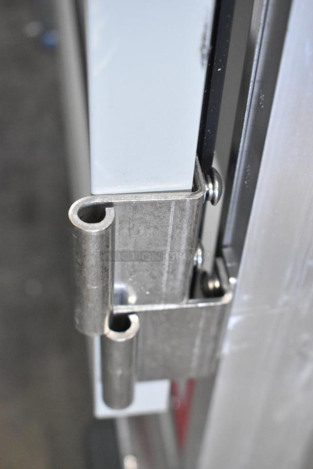 Close-up of hinge on Avantco 177HEAT1836I Insulated Heated Holding Cabinet. Brand new, minor scratch and dent, commercial casters.