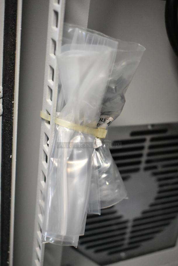 Hoffmann Spectracool Compact AC, Model N170116G010, new, 115V, 1025 BTU. Plastic packaging partially visible.