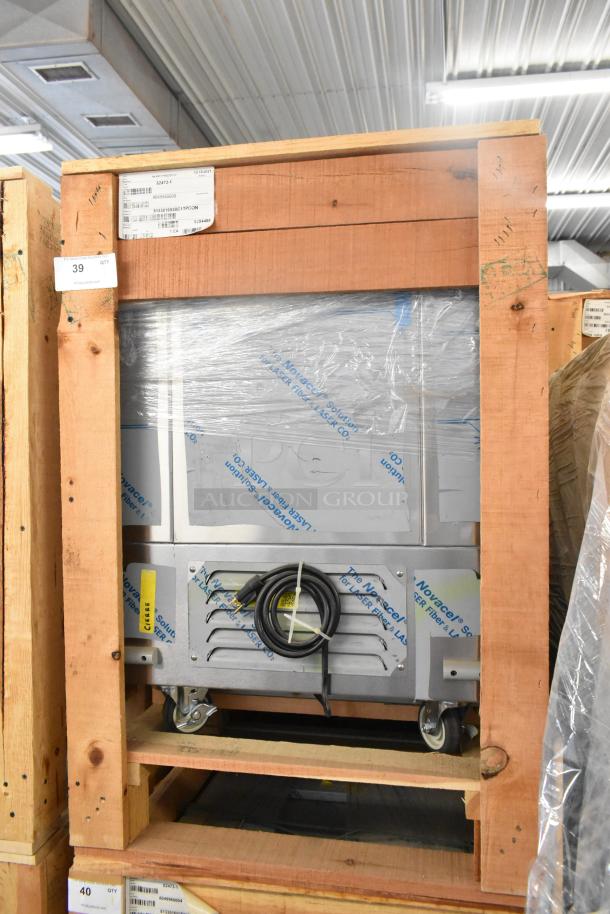 Brand new BKI 52473-1 stainless steel commercial freezer, on casters, in packaging. 115V, 1 phase. Industrial setting.
