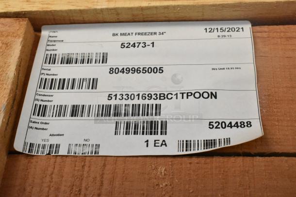 Label on the BKI 52473-1 stainless steel commercial freezer, showing model, serial, and condenser numbers.