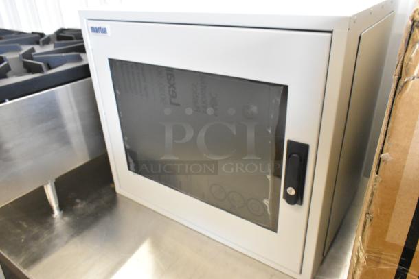 Brand new Martin white metal box with glass door, lock handle, and logo label on top left. Suitable for storage or display.