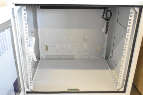Brand new Martin white metal box, open door view, showing pristine interior and cable management.