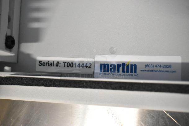 Brand new Martin white metal box, serial #T0014442. Features Martin International Enclosures label, pristine condition.