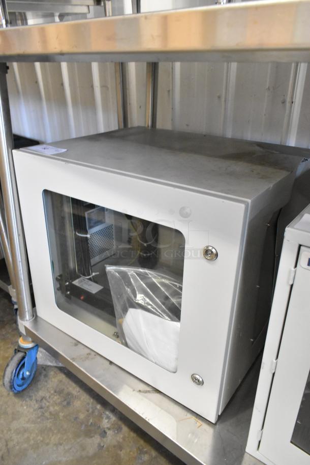 Brand new Telege white metal case with locked door, transparent side, visible cables.