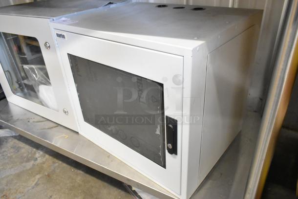 Brand new Martin white metal enclosure, features front glass panel and secure locking mechanism, in pristine condition.
