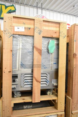 BKI 52473-1 stainless steel commercial freezer, brand new, in crate. Features commercial casters, 115 volts, 1 phase.