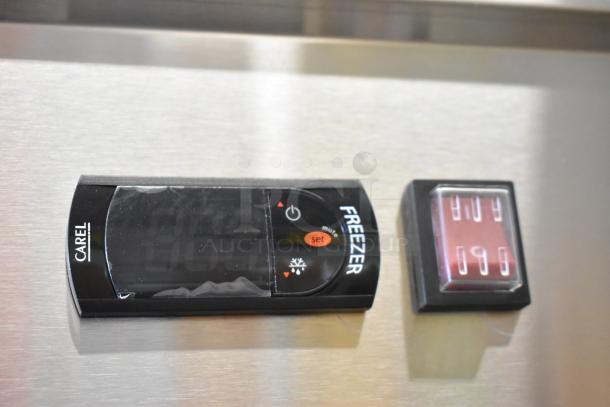 Stainless steel panel of Avantco 178SS3FHC freezer showing digital control display and indicator light.