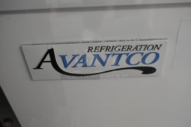 Avantco 193BC48HCW metal commercial bakery display case, curved glass, white, 48-inch, 115V, label detail shown. Glass damage noted.