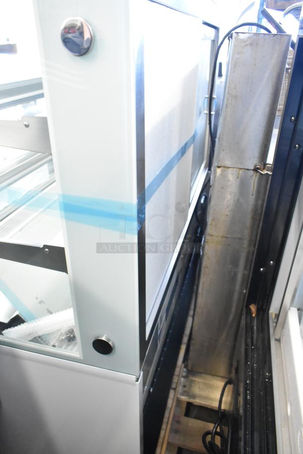 Brand new Avantco 193BC48HCW 48" white refrigerated bakery display case, curved glass, 115V, 1 phase, noted glass damage.