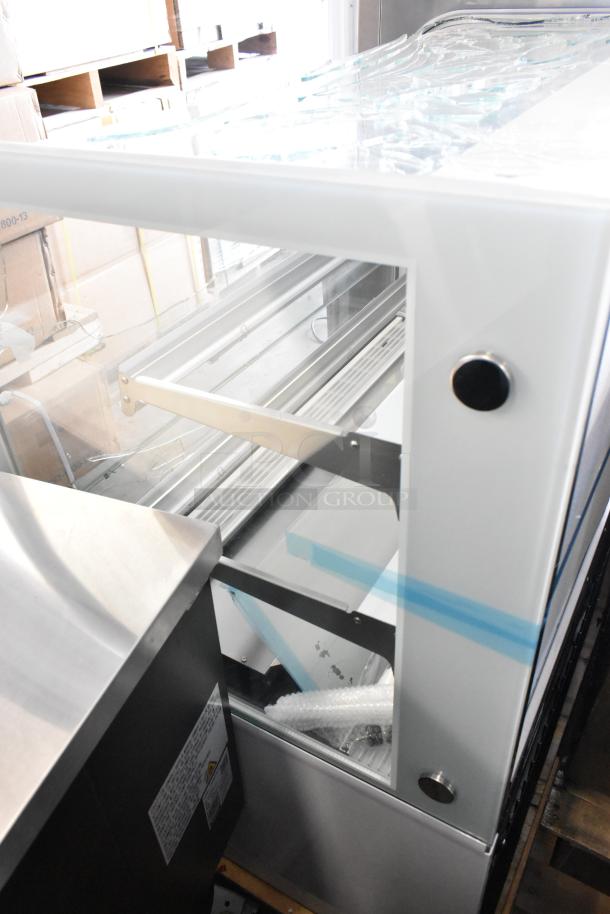 Avantco 193BC48HCW 48" refrigerated bakery display case, white, with curved glass; note glass damage. 115V, 1 Phase.