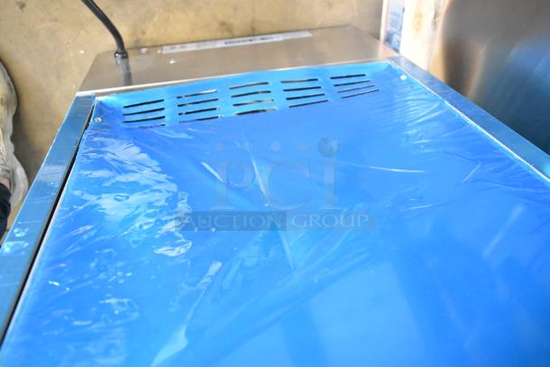 Brand new 2024 Avantco 177VBE102M vertical broiler, stainless steel, 65 lb. capacity, 208/240 volts, 1 phase, blue protective film.