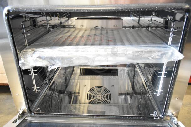 Brand new Avantco 177CO28M stainless steel convection oven, 2.3 cu. ft., visible broken glass, 208/240V, 1 Phase.