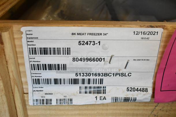 BRAND NEW 2021 BKI 52473-1 stainless steel commercial freezer on casters, 115 volts, 1 phase, label showing model and serial numbers.