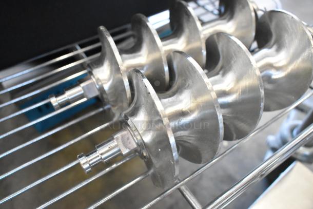 Brand new Backyard Pro Butcher Series #32 grinder augers on a metal rack, showing slight scratches.