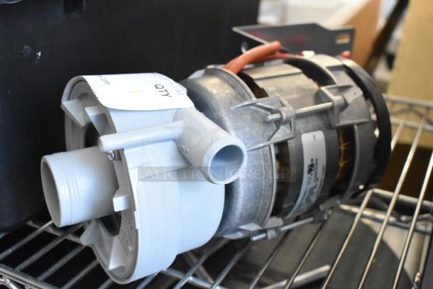 Brand new Nidec pump, 115 volts, 1 phase. Visible scratches and dents. Includes label indicating model and voltage.