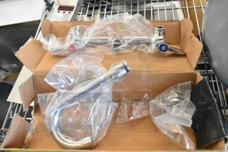 BRAND NEW 600FW84G Regency wall mount faucet, 3 1/2" swivel gooseneck, 8" centers, in packaging, minor scratches.
