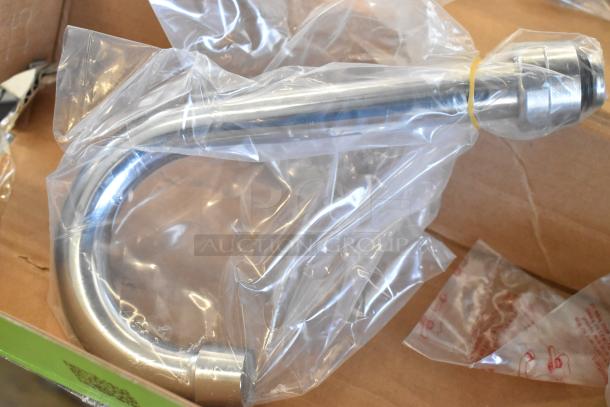 Brand new 600FW84G Regency wall mount faucet with 3.5" swivel gooseneck spout, 8" centers, in protective packaging.