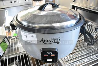 Brand new Avantco 177RCB60 60 cup electric rice cooker, scratch and dent, with removable lid, label indicating auction details.