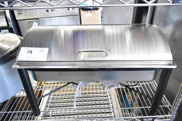 Brand new scratch and dent stainless steel chafer, with slight imperfections, displayed on a metal rack.