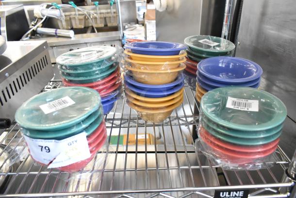 Lot of 48 brand new GET B-105-MIX Diamond Mardi Gras 10 oz. melamine bowls in assorted colors on display. Some are shrink-wrapped and show light scratches.