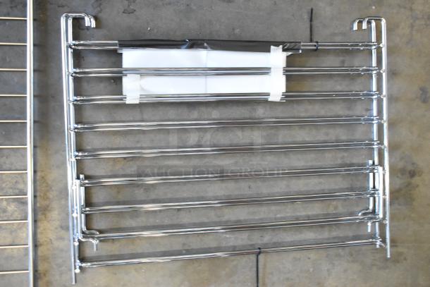 Brand new Blodgett oven parts, including a center gasket retainer, wire rack, and rack support set.