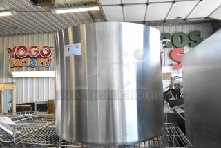Brand new Choice 471SP140QTHD 140 Qt. heavy weight aluminum stock pot, minor scratches visible, with sturdy handles.