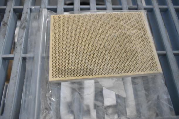 Brand new scratch and dent grate, perforated design, in clear packaging. Part of auction items.