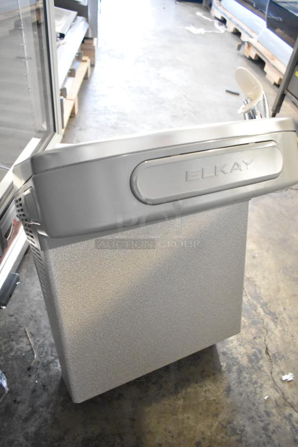Brand new Elkay EZSDWS_1G metal wall mount water fountain with bottle filling attachment, minor scratches visible.