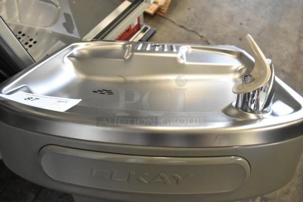 Brand new Elkay EZSDWS_1G metal wall mount water fountain with bottle filling attachment, minor scratches visible.