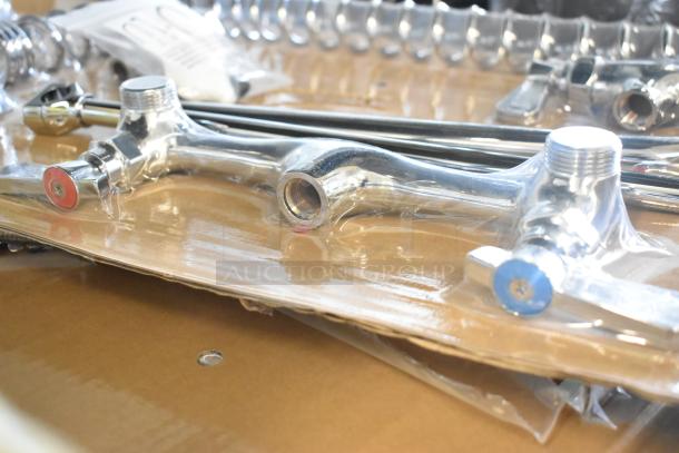 Brand new chrome faucet, scratched, handles marked red and blue, includes hardware, in packaging.