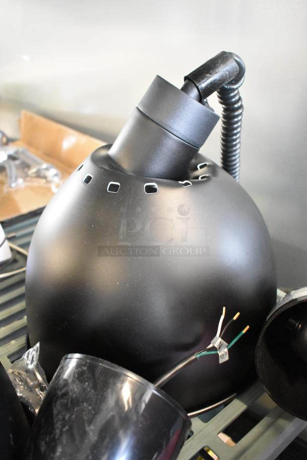2 ServIt 423HLR85BK heat lamps, retractable cord, black dome shade, 120V, 1 phase, new with minor scratches.