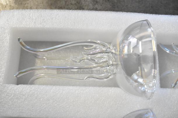 Box of 6 brand new glasses with minor scratches and dents, featuring intricate clear glass designs, in foam packaging.