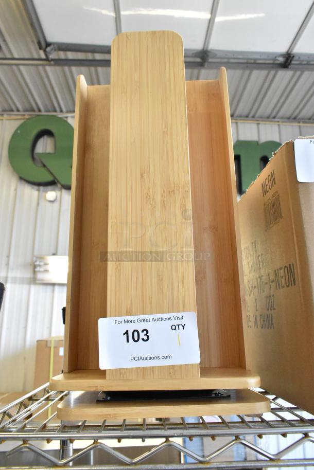 Brand new wooden countertop rack, slight scratches. Label reads "103 QTY, PCIAuctions.com." Perfect for kitchen storage.