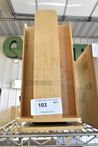 Brand new wooden countertop rack, slight scratches. Label reads "103 QTY, PCIAuctions.com." Perfect for kitchen storage.