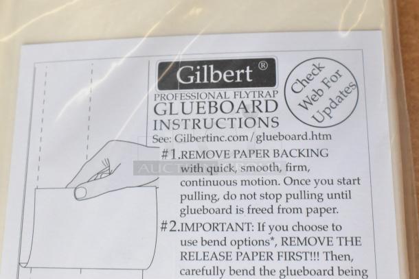 Six new scratch and dent boxes of Gilbert 10226042 5"x17" Glueboard. Instructions label visible.