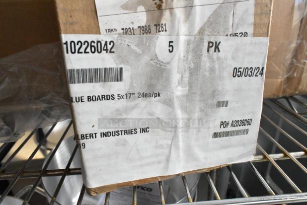 6 new scratch and dent boxes of Gilbert 10226042 glueboards, 5"x17", 24 per pack. Labels visible, PO# A2036060.