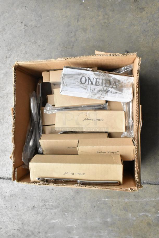 Brand new scratch and dent box with Oneida 62620-26 dessert forks and 62620-11 table knives; visible box wear, sealed packaging.