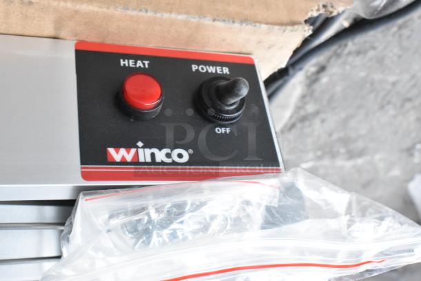 Winco ESH-60 60" strip heater with toggle switch, new condition, 120V, 1 phase. Heat and power controls visible.