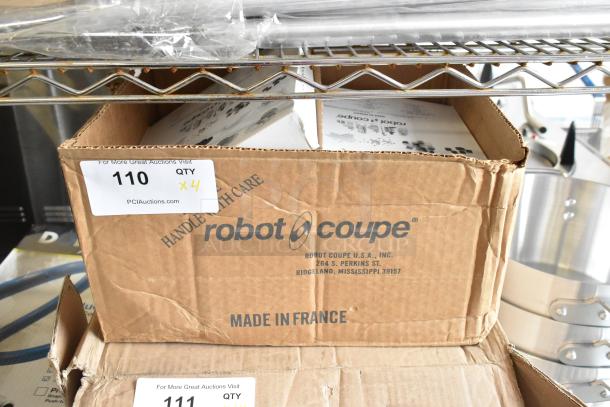 Brand new Robot Coupe food processor blades in original packaging; models 28059W, 28053W, 28112W, 28065W; minor box dents.