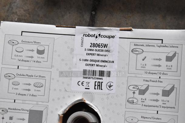 Box of Robot Coupe food processor blades, model 28065W. Includes grater, julienne, dicer, slicer. New condition.