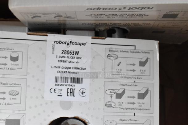 14 brand new Robot Coupe food processor blades, models 28135W to 28173W, in original packaging.