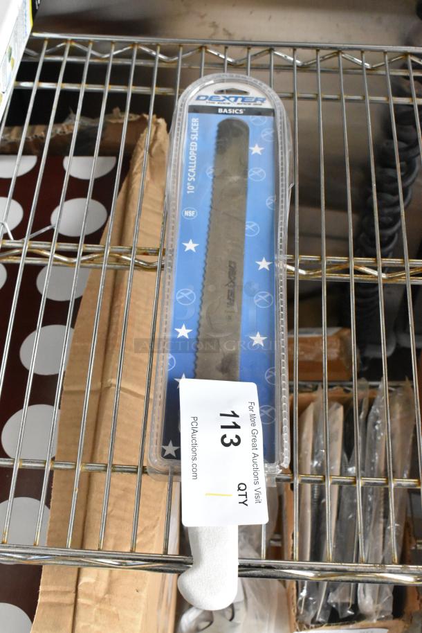 Brand new Dexter 10" scalloped slicer knife in packaging. Labeled "NSF" and "Dexter Basics," on a shelf with auction tag "113."