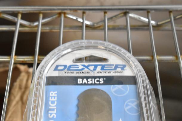 Brand new Dexter 10" scalloped slicer knife in package, minor scratches and dents, visible "Dexter Basics" label.