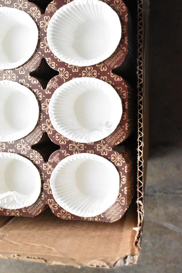 Box of muffin liners with decorative brown and gold holders, brand new, slight box damage.