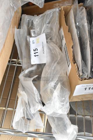 10 new stainless steel utensils, including HLB-6 pie server and spatula. Scratch and dent. Wrapped in plastic. Tag indicates quantity.