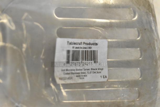 Stainless steel utensil with slotted design and Tablecraft Products label. Anti-microbial coating, 13.5 inches, made in India.