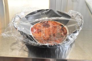 Box of 12 brand new Vollrath 9.5" Paella Pans, partially wrapped in plastic, labeled "Carbon Steel Cookware."