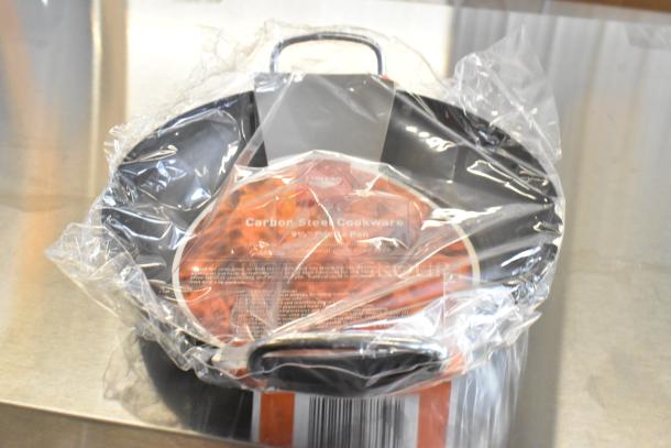 Box of 12 brand new 9.5" Vollrath 10149300 paella pans. Carbon steel, minor scratches and dents. Plastic wrapped.
