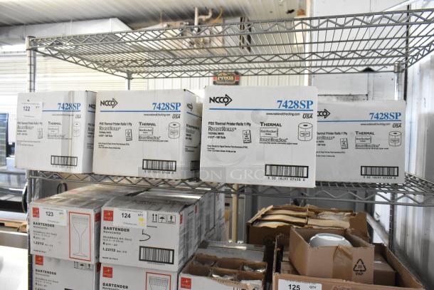 11 new boxes of 7428SP POS Thermal Printer Rolls on a metal shelf, scratch and dent condition, NCCO brand.