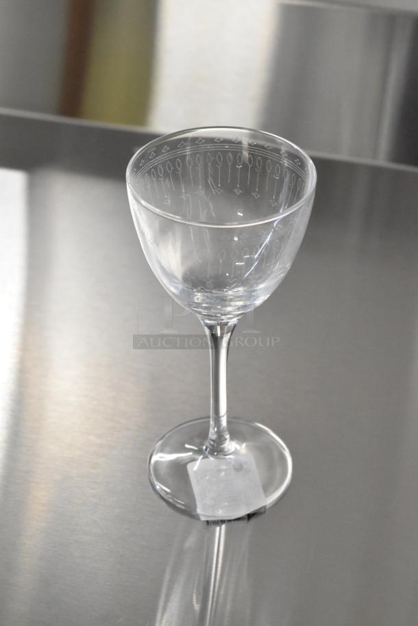 8 boxes of 6 Bormioli Rocco Bartender Nick & Nora glasses, new with minor scratches. Clear glass with etched design.
